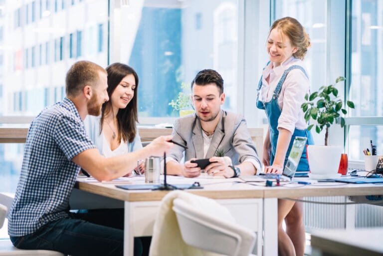 colleagues browsing smartphone discussion 2